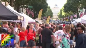 Raleigh Pride 2025 crowd screenshot featuring equality messages – JRL CHARTS