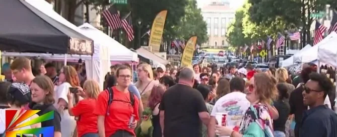 Raleigh Pride 2025 crowd screenshot featuring equality messages – JRL CHARTS