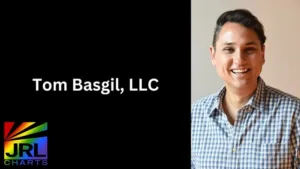 Tom Basgil smiling in button-up shirt as his agency earns LGBTBE certification via NGLCC – JRL CHARTS