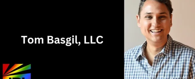 Tom Basgil smiling in button-up shirt as his agency earns LGBTBE certification via NGLCC – JRL CHARTS