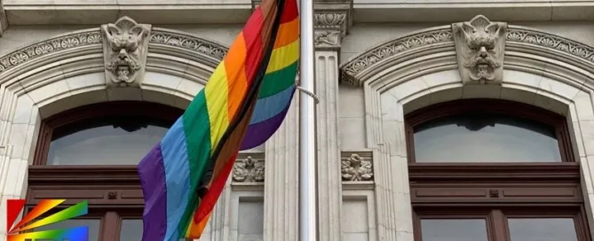 Progress Pride flag flying outside Philadelphia City Hall, symbolizing LGBTQ+ unity and inclusion in local government
