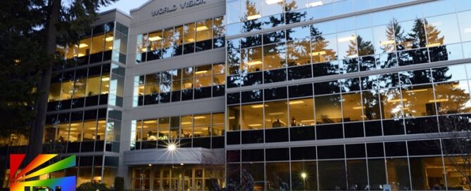 World Vision headquarters with legal scales overlay, symbolizing 9th Circuit Court ruling on LGBTQ hiring rights and ministerial exception – JRL CHARTS