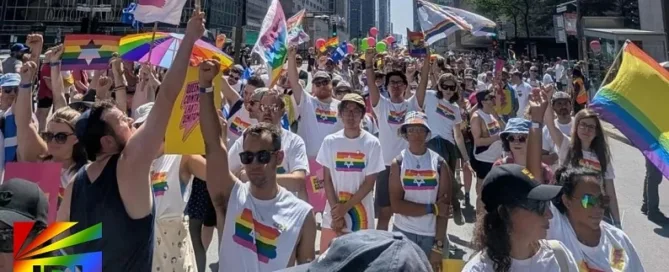 JRL CHARTS coverage – Jewish LGBTQ marchers at Montreal Pride waving rainbow flags and Stars of David after Zionist ban reversal – Photo by Julien Corona.