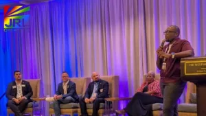 Florida State Senator Carlos Guillermo Smith speaks at the Florida LGBTQ+ Democratic Caucus summer meeting in Tampa, warning that DOGE audits could strip LGBTQ program funding. Photo © Mitch Perry/Florida Phoenix via NPR | JRL CHARTS