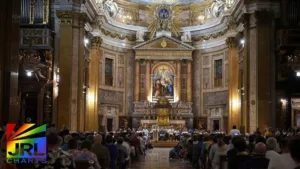 Members of the LGBTQ community attend vigil prayer during the LGBT pilgrimage Mass at the Church of the Gesù in Rome, led by Bishop Francesco Savino.