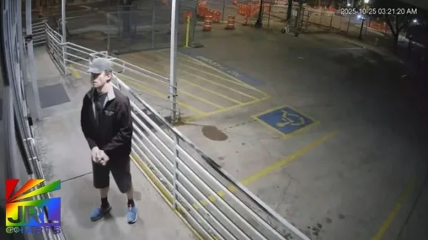 Surveillance image of suspect allegedly smashing windows at The Center on Colfax during anti-LGBTQ vandalism incident in Denver