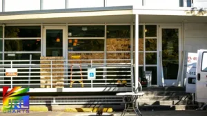 Boarded-up window at The Center on Colfax after vandalism in suspected anti-LGBTQ hate crime in Denver