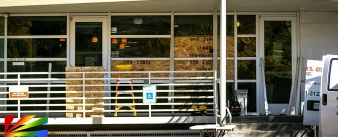 Boarded-up window at The Center on Colfax after vandalism in suspected anti-LGBTQ hate crime in Denver