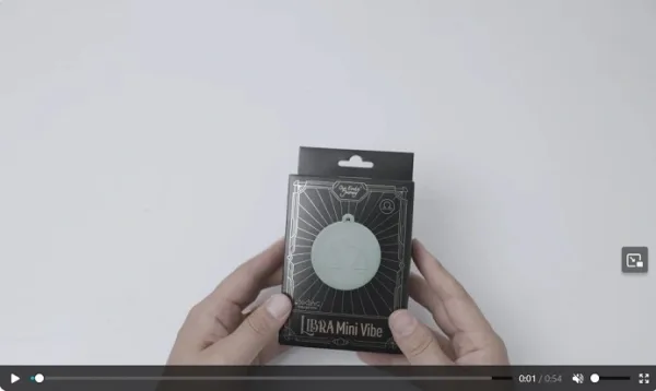 Screenshot of Libra Mini Vibe demo video from Our Erotic Journey showing compact pink vibrator and packaging from the Zodiac Collection.
