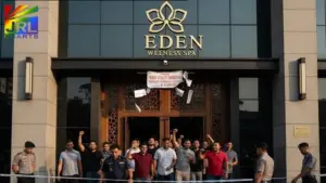 Men standing outside Eden Wellness Spa in Kuala Lumpur after Malaysian police raided the alleged gay spa and detained over 200 people, as reported by JRL CHARTS.