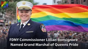 FDNY Commissioner Lillian Bonsignore in official uniform standing before a Pride flag during a Queens Pride Parade announcement in New York City.