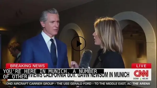 Gavin Newsom speaks during a CNN interview in Munich addressing U.S. political issues and national leadership topics.