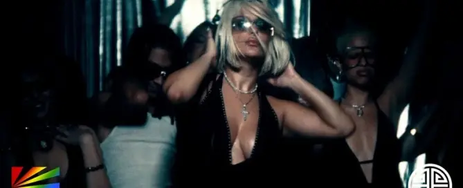 Bebe Rexha in the New Religion official music video visual with dancers and nightclub lighting