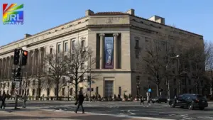 Exterior view of the Federal Bureau of Investigation headquarters building in Washington, D.C., with pedestrians crossing the street during daytime