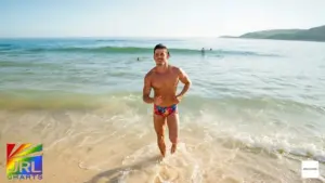 Model wearing floral Daisies Swimwear Line by MODUS VIVENDI in Salty Blossoms campaign under Brazilian beach sun