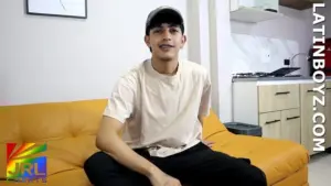 Teo LatinBoyz Colombian model sitting on couch during newcomer introduction