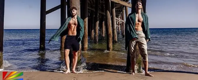 Kane Fox and Dex Devall stand beneath a California pier in CockyBoys’ cinematic summer feature “The Getaway.”