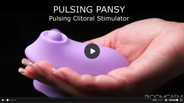 Close-up of Pulsing Pansy wellness device demonstrating compact design and soft-touch material