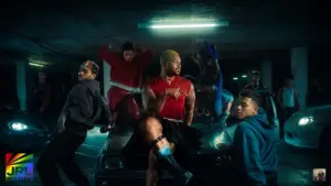 MNEK performs with dancers in a cinematic underground parking garage scene from the REVERSE!! official music video.