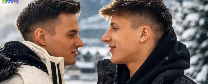 Josh Mendes and Lincoln Carrel share a romantic winter moment in a cinematic Hollywood-style promotional image for Freshmen.net.