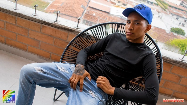 Diego of Venezuela poses on a modern urban balcony during his official debut photo shoot for LatinBoyz.